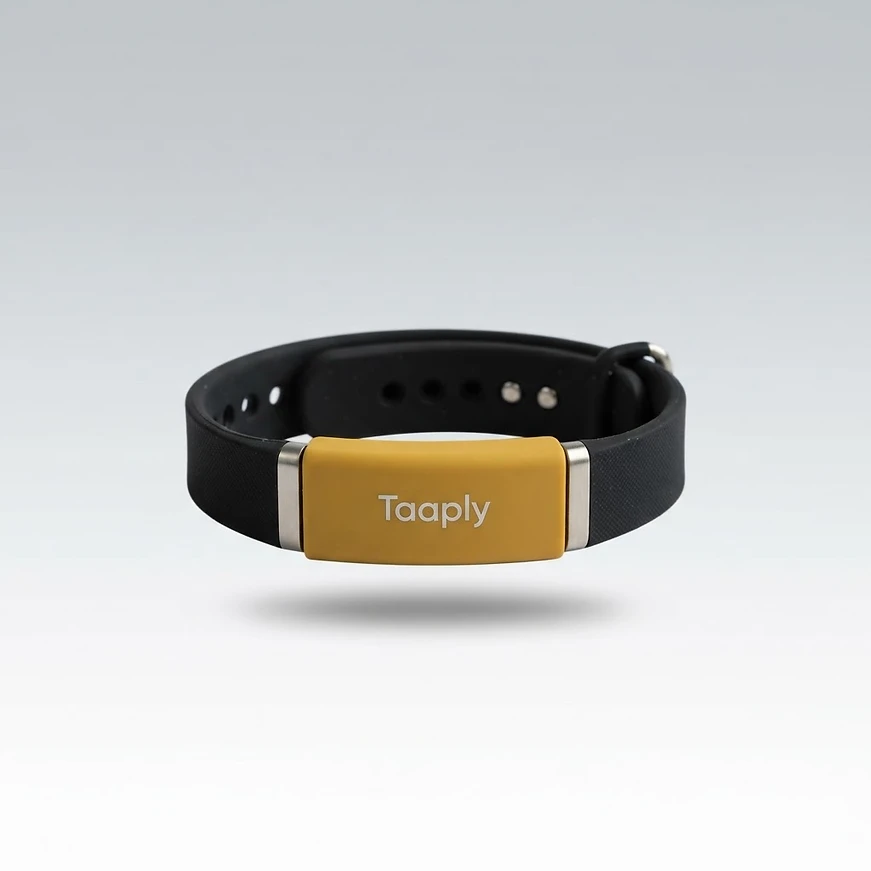 A black silicone Taaply smart bracelet with a yellow NFC clasp