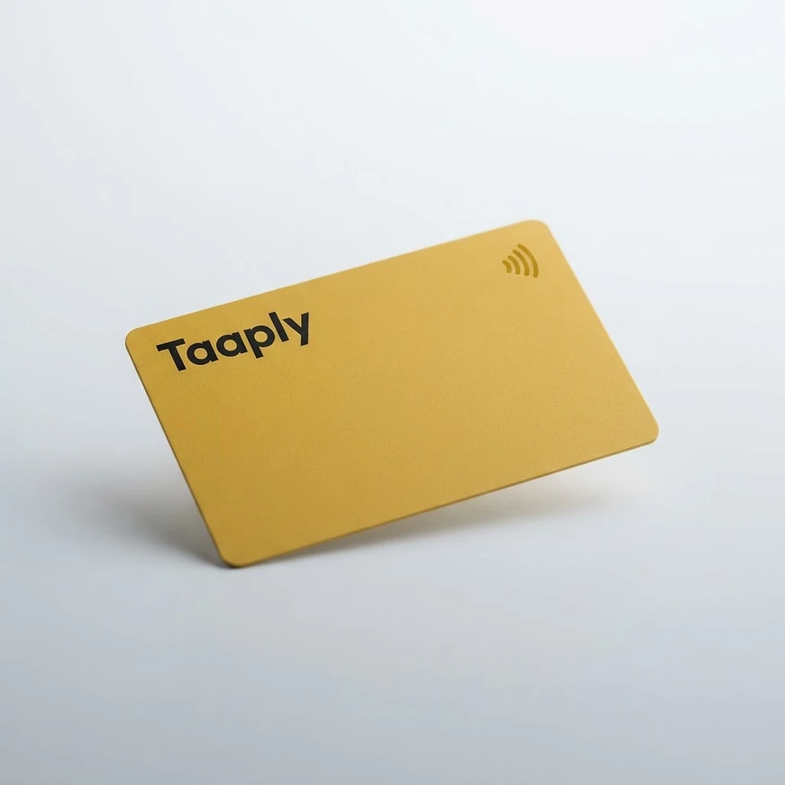 A yellow Taaply NFC smart card standing on its edge, with the Taaply wordmark and a contactless symbol